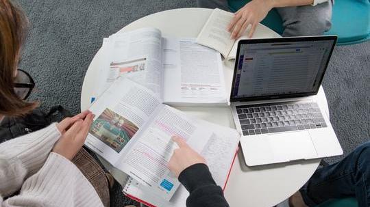 students studying at a table