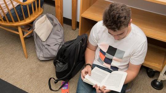 student reading a book