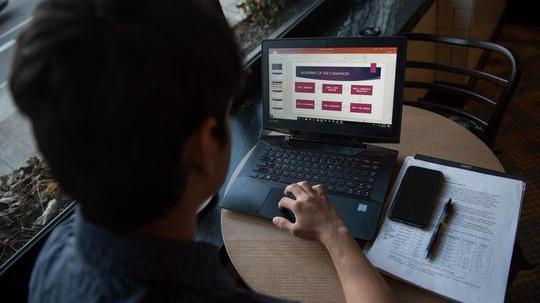 Student studying with laptop