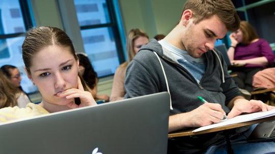 two students in a classroom