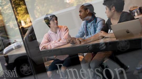 three students having a discussion